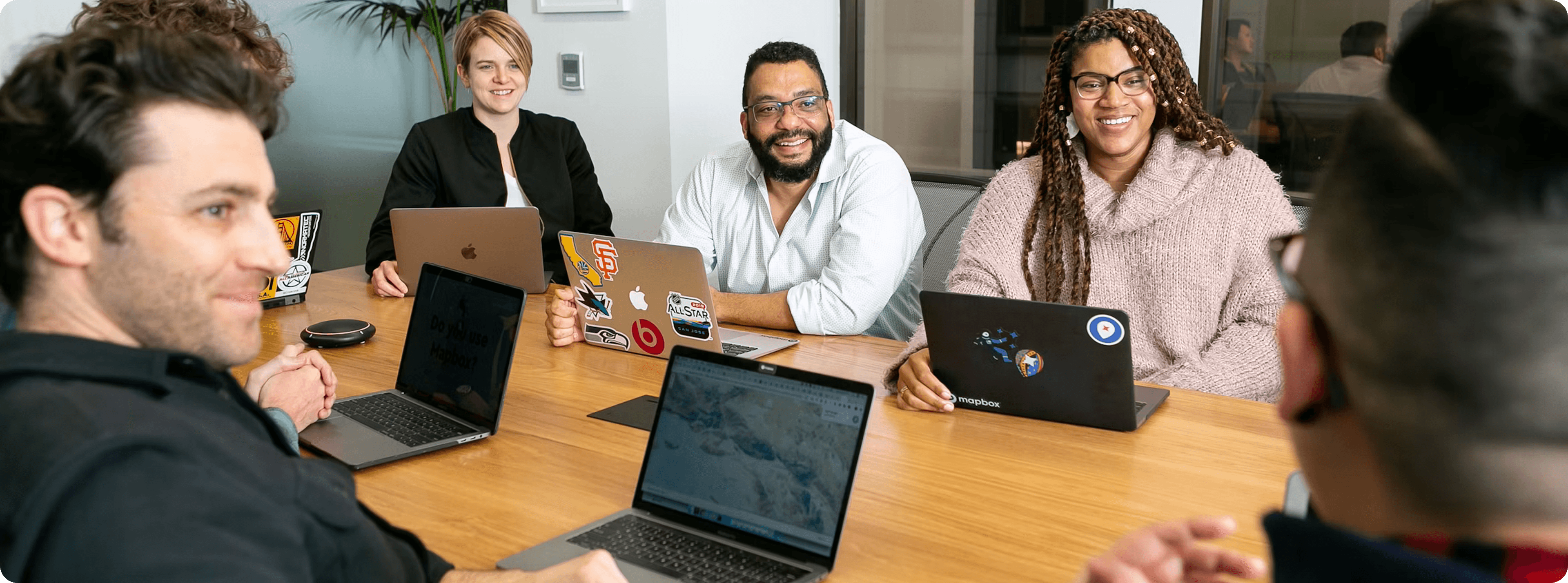 Valnee founders and partners collaborating around a table